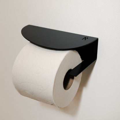Wall-mounted toilet roll holder in powder-coated steel